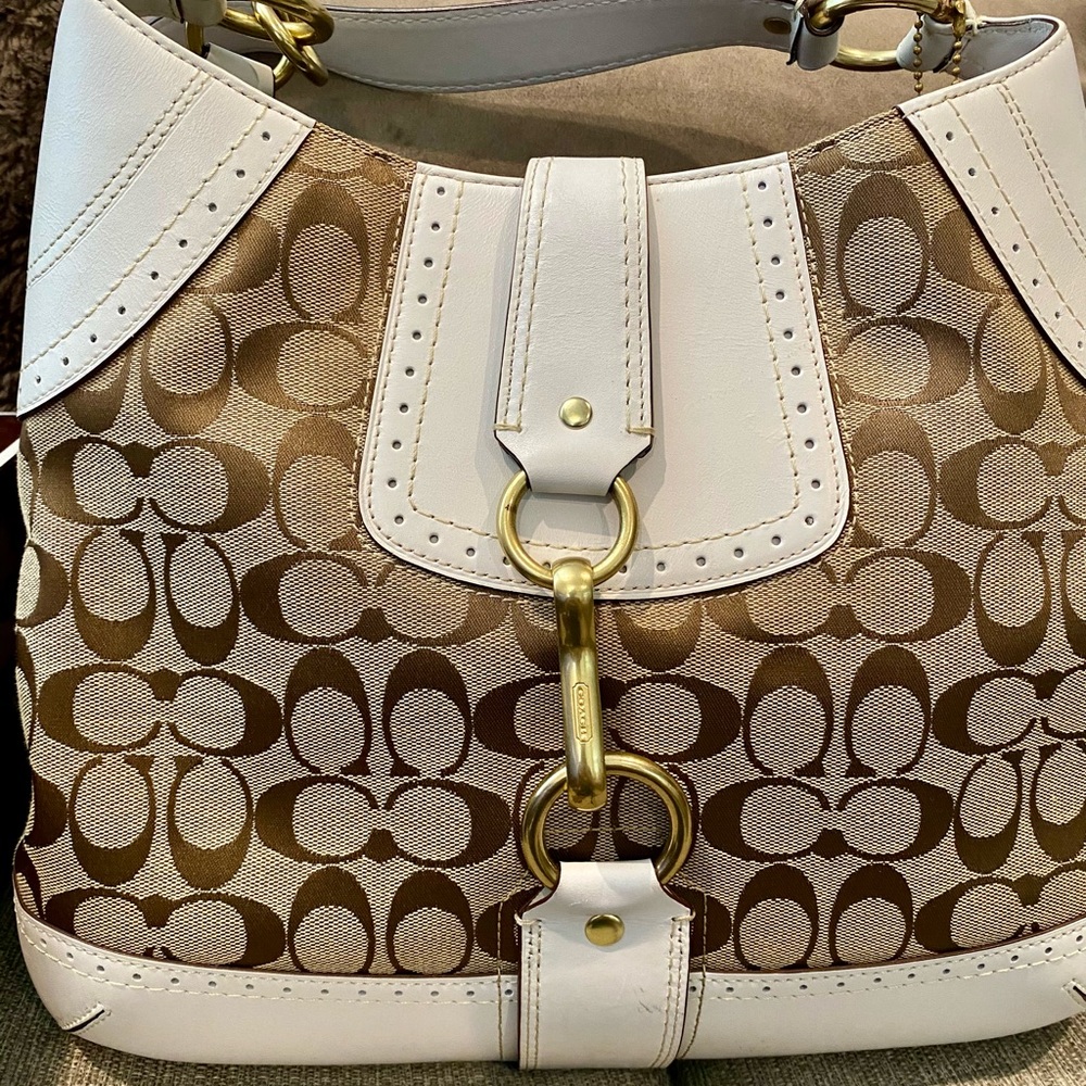 Authentic Coach canvas and leather signature with gold hardware. Like New!